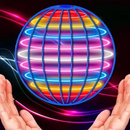 Colorful LED ball held between two hands against a dark background