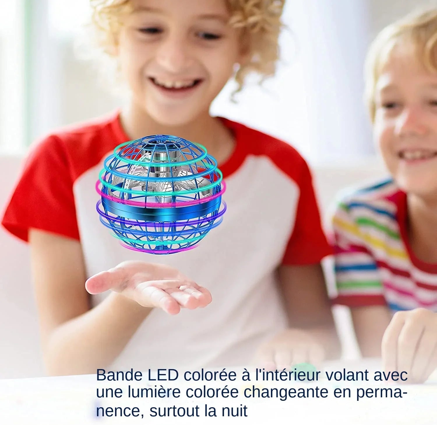 Children playing with a colorful LED flying ball